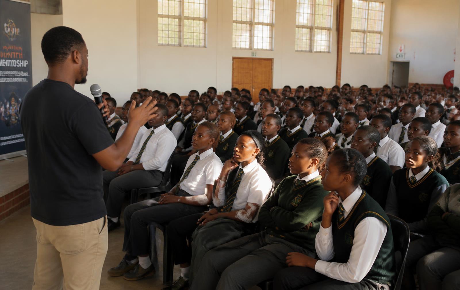 Learners in a school hall during a youth mentorship session
